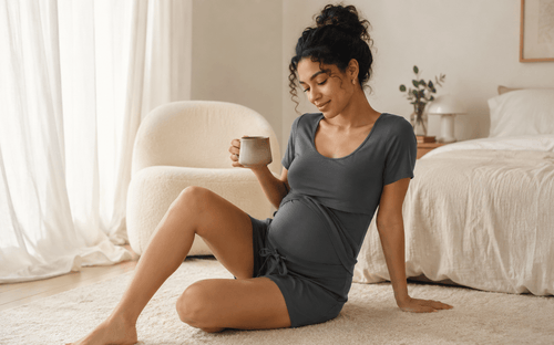 pregnant woman wearing a matching maternity lounge set at home