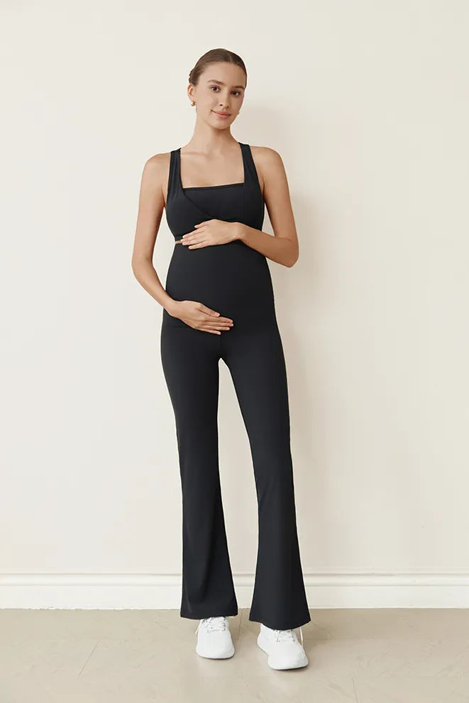 Black Flow With Me Flare Leggings designed to accommodate a growing bump during pregnancy