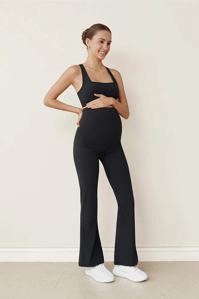 Side view of Bonbump Flow With Me Flare Leggings in Black with a modern flare-leg silhouette