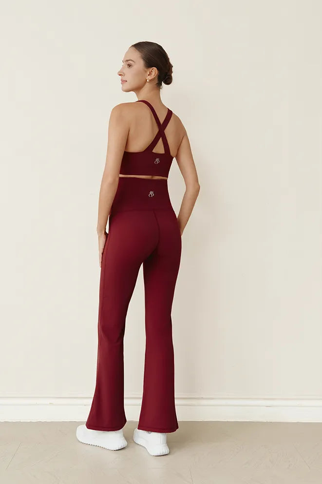 Burgundy maternity flare leggings designed for pregnancy and postpartum wear