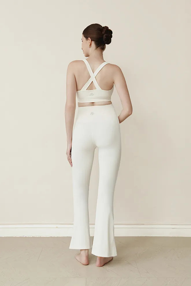 Cream maternity flare leggings designed to move comfortably through pregnancy and postpartum