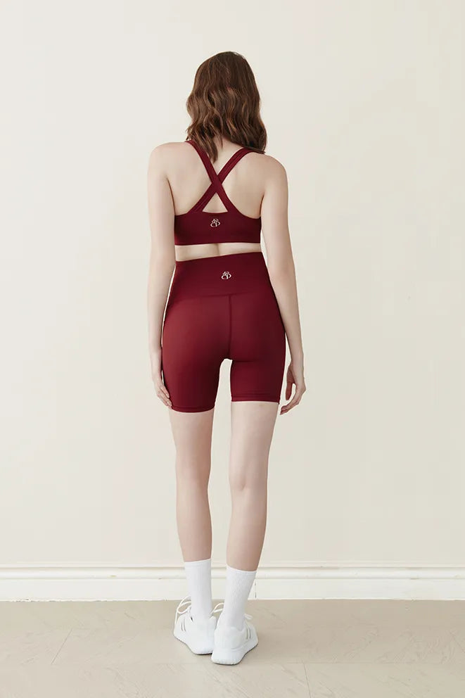 Burgundy maternity biker shorts designed for movement during pregnancy