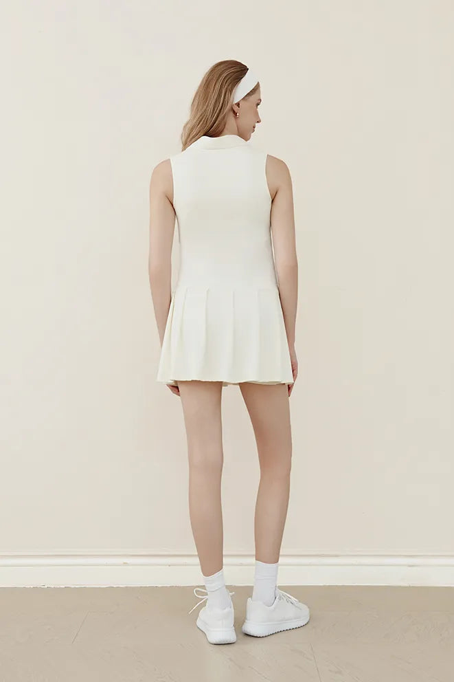 Cream maternity tennis dress suitable for tennis, pickleball, and active days