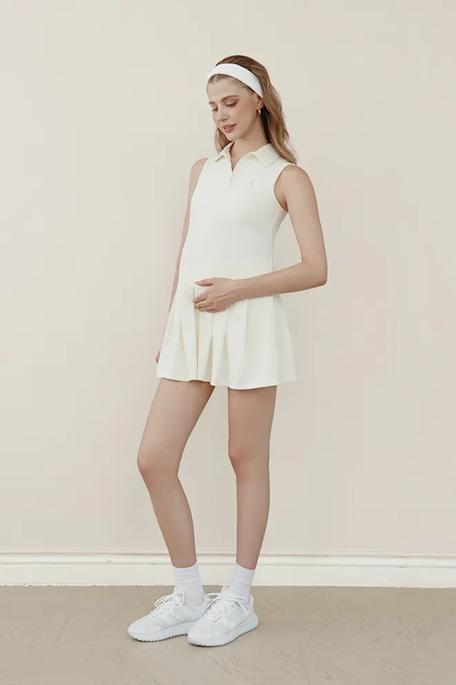 Rally Ready Tennis Dress in Cream designed as versatile maternity activewear